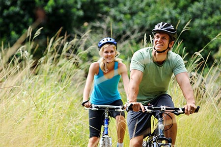 Couples riding bikes