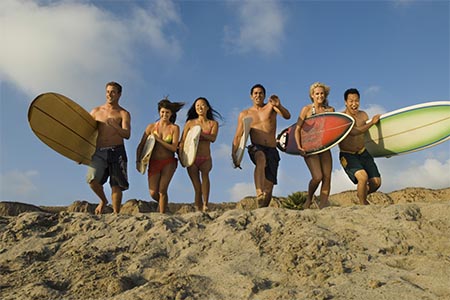 Young people going for surf
