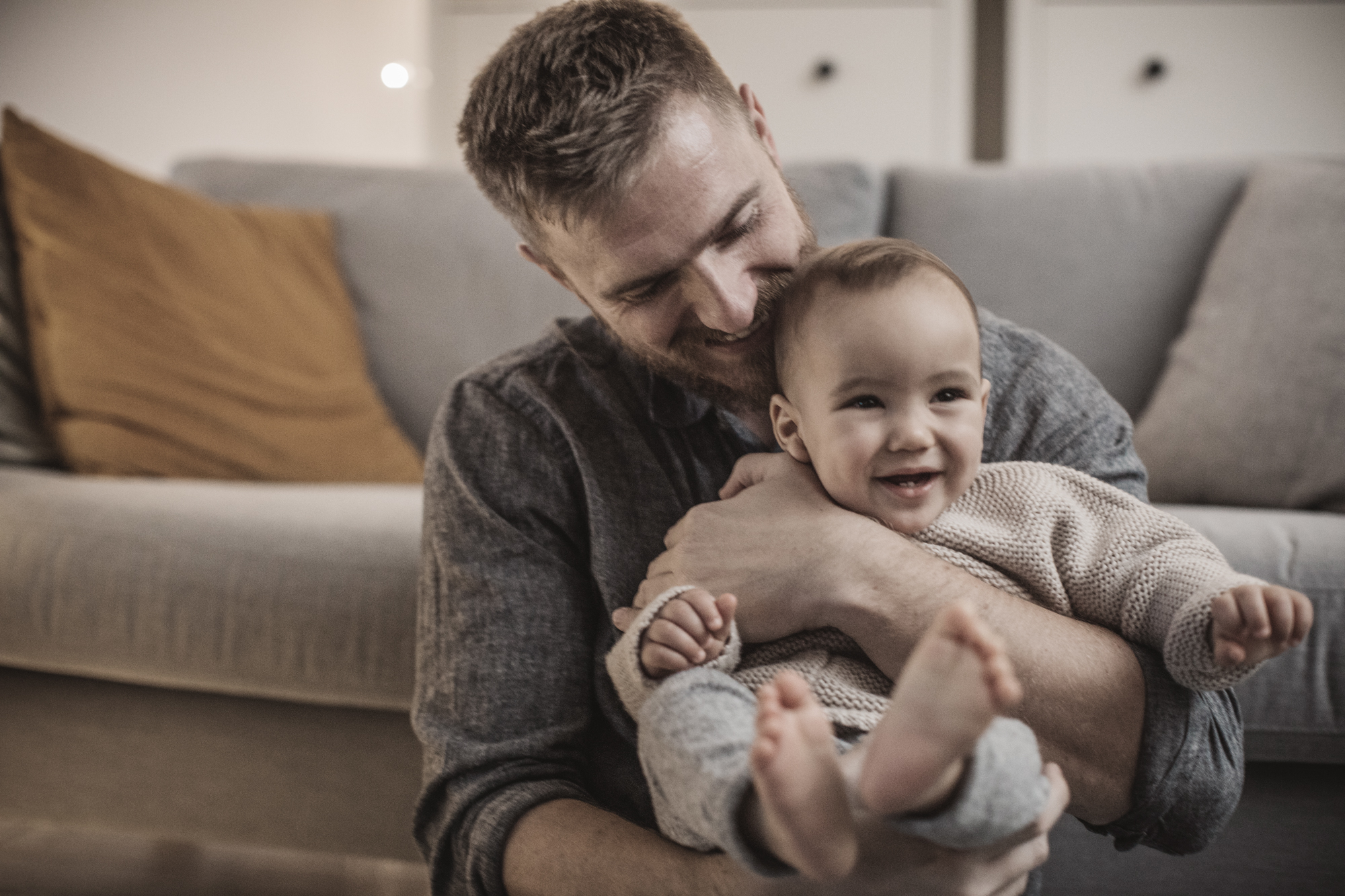 A man playing with his baby