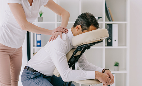 Staff getting massage at workplace